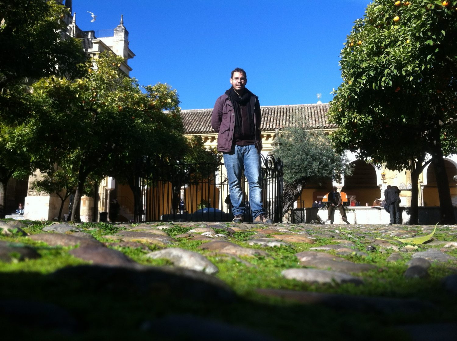 Dr. George Archer taking a walk on the pagan Roman foundations of the Islamic mosque courtyard of the Catholic Catedral de Santa María de la Sede.
